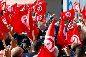 Tunisian presidential candidate Nabil Karoui greets supporters from a car during an election campaign event ahead of Sunday’s second-round runoff election in Bizerte Tunisian presidential candidate Nabil Karoui greets supporters from a car during an election campaign event ahead of Sunday’s second-round runoff election in Bizerte