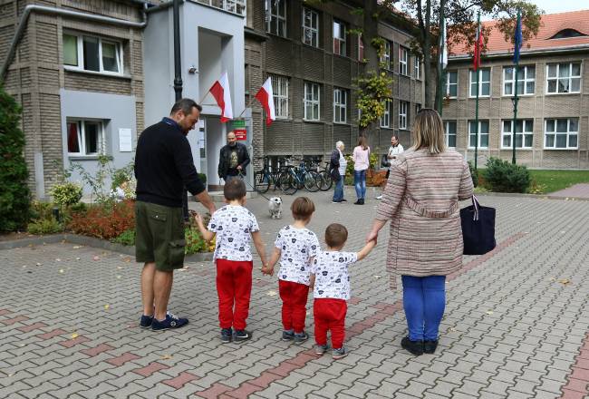People are seen outside a polling station during parliamentary election, in Warsaw People are seen outside a polling station during parliamentary election, in Warsaw