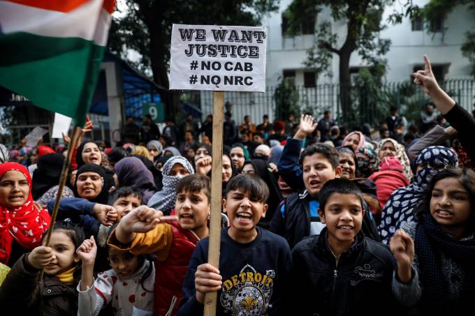 Young demonstrators shout slogans during a protest against a new citizenship law, outside the Jamia Millia Islamia university in New Delhi