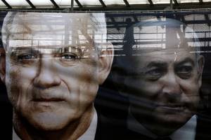 FILE PHOTO: A banner depicts Benny Gantz, leader of Blue and White party, and Israel Prime minister Benjamin Netanyahu, as part of Blue and White party’s campaign ahead of the upcoming election, in Tel Aviv