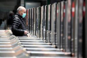 Man in a face mask is seen at the Cadorna railway station in Milan