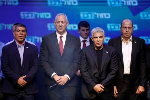 FILE PHOTO: Blue and White party leader Benny Gantz and party co-leaders Yair Lapid, Moshe Yaalon and Gaby Ashkenazi react at the party’s headquarters following the announcement of exit polls during Israel’s parliamentary election in Tel Aviv
