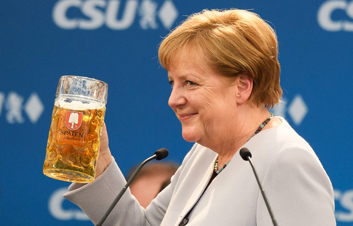 MUNICH, GERMANY - MAY 28: German Chancellor and Chairwoman of the German Christian Democrats (CDU) Angela Merkel holds a beer mug after her speech at the Trudering fest on May 28, 2017 in Munich, Germany. The CDU and CSU, along with the German Social Democrats (SPD), form the current German coalition government, though relations between Merkel and Seehofer have been complicated as the two have clashed over certain issues, especially immigration. (Photo by Sebastian Widmann/Getty Images)