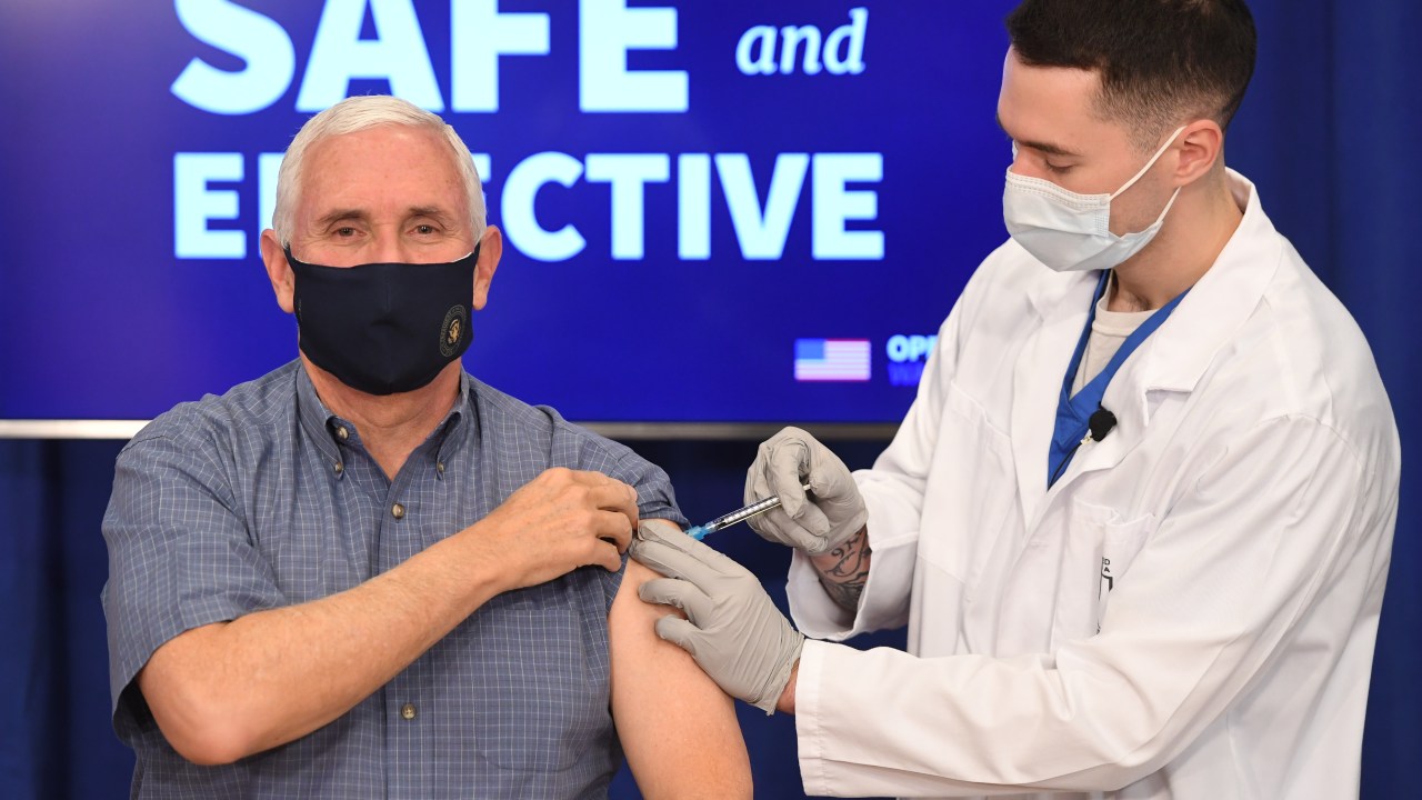 US Vice President Mike Pence receives the COVID-19 vaccine in the Eisenhower Executive Office Building in Washington, DC, December 18, 2020. (Photo by SAUL LOEB / AFP)