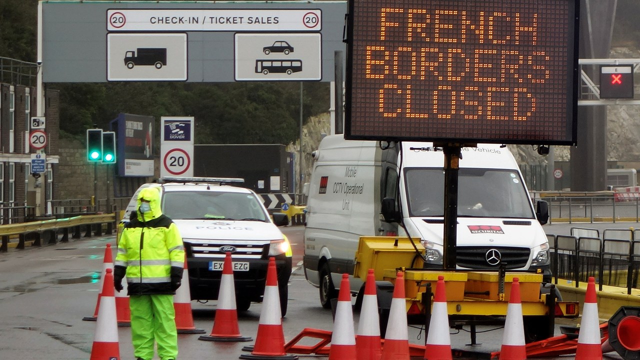 A sign alerts customers that the "French Borders are Closed" at the entrance to the Port of Dover in Kent, south east England on December 21, 2020, as a string of countries banned travellers all but unaccompanied freight arriving from the UK, due to the rapid spread of a more-infectious new coronavirus strain. - Britain's critical south coast port at Dover said on Sunday it was closing to all accompanied freight and passengers due to the French border restrictions "until further notice". (Photo by William EDWARDS / AFP)