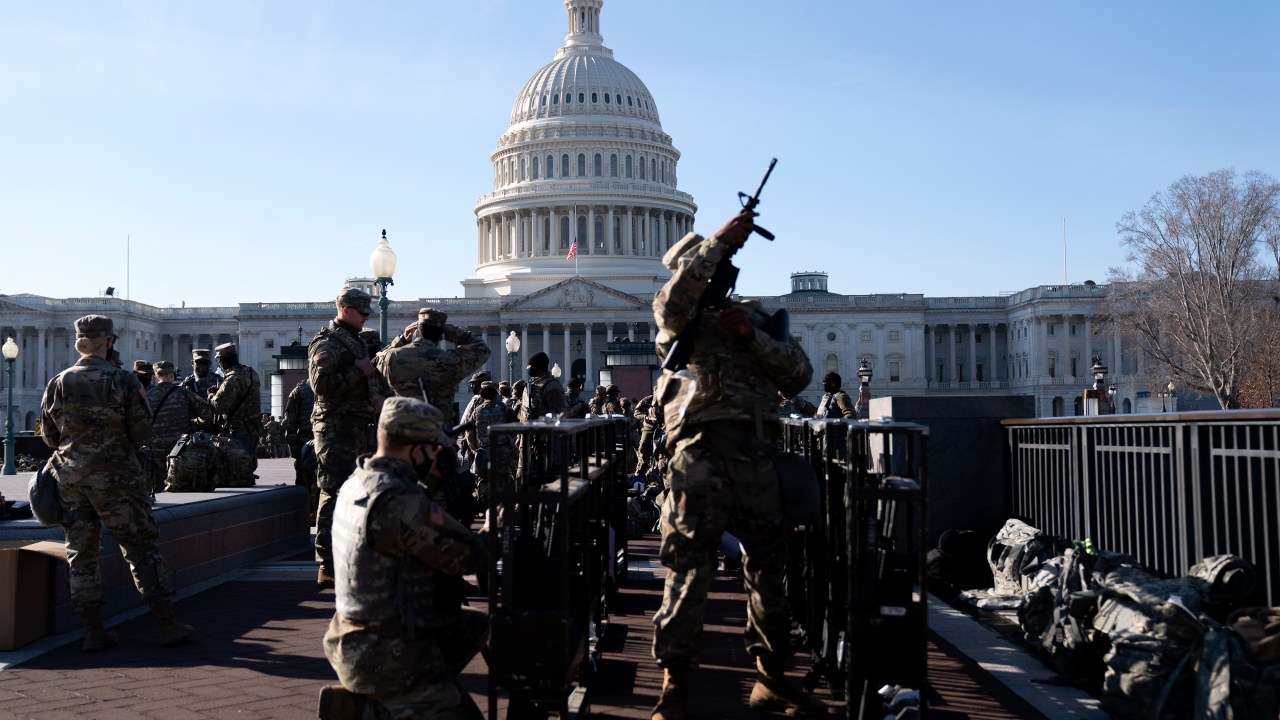 WASHINGTON, DC - JANUARY 14: Members of the National Guard prepare to distribute weapons outside the U.S. Capitol on January 14, 2021 in Washington, DC. Security has been increased throughout Washington following the breach of the U.S. Capitol last Wednesday, and leading up to the Presidential Inauguration. Stefani Reynolds/Getty Images/AFP