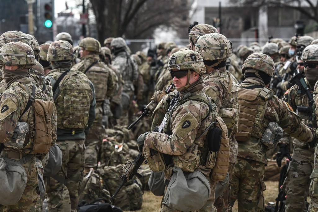 WASHINGTON, DC - JANUARY 19: National Guard patrol the National Mall on January 19, 2021 in Washington, DC. Tight security measures are in place for Inauguration Day due to greater security threats after the attack on the U.S. Capitol on January 6. Stephanie Keith/Getty Images/AFP