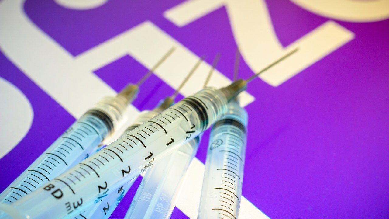 .BRAZIL - 2020/12/13: In this photo illustration, various medical syringes seen displayed on a screen with the Pfizer company logo in the background. (Photo Illustration by Rafael Henrique/SOPA Images/LightRocket via Getty Images)