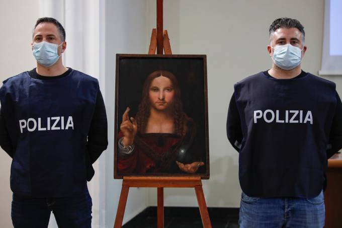 Policeman show the “Salvator Mundi”, a painting from the