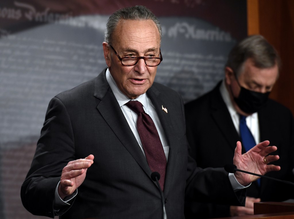 US Senate Majority Leader Chuck Schumer, Democrat of New York, with Senate Democratic Whip, Dick Durbin (R), Democrat of Illinois, speaks during a press conference at the US Capitol, on February 2, 2021, in Washington, DC. (Photo by OLIVIER DOULIERY / AFP)