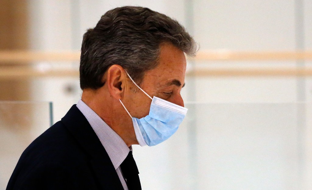 PARIS, FRANCE - DECEMBER 10: Former French President Nicolas Sarkozy leaves the court for a break for the last day of his trial on corruption charges in the so-called 'wiretapping affair' on December 10, 2020 in Paris, France. When Mr. Sarkozy first appeared in court last month, on charges of corruption and influence-peddling, he became the first French president in modern times to appear in the dock. Prosecutors allege he and a codefendant tried to bribe a magistrate in relation to a separate investigation into his party finances. Prosecutors are seeking a four-year prison term for Sarkozy, of which he would serve two. (Photo by Chesnot/Getty Images)