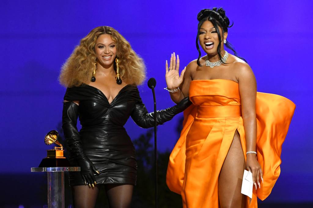 LOS ANGELES, CALIFORNIA - MARCH 14: (L-R) Beyoncé and Megan Thee Stallion accept the Best Rap Performance award for 'Savage' onstage during the 63rd Annual GRAMMY Awards at Los Angeles Convention Center on March 14, 2021 in Los Angeles, California. (Photo by Kevin Winter/Getty Images for The Recording Academy)
