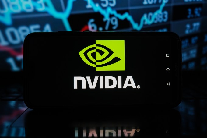 In this photo illustration a Nvidia logo seen displayed on a