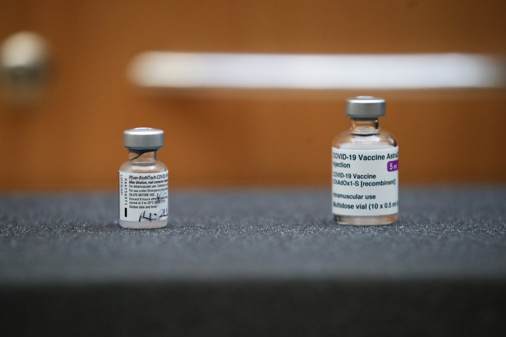 LONDON, ENGLAND - MARCH 09: The first ever vials of the Pfizer-BioNTech and Oxford/Astra Zeneca Covid-19 vaccinations are on display at Skipton House on March 9, 2021 in London, England. (Photo by Aaron Chown-WPA Pool/Getty Images)