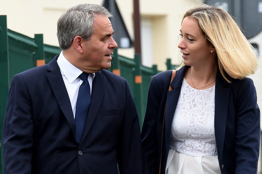 Xavier Bertrand, former minister and candidate to his succession as president of the northern France Hauts-de-France region, and his wife Vanessa arrive to vote at a polling station in Saint-Quentin, for the second round of the French regional elections on June 27, 2021.