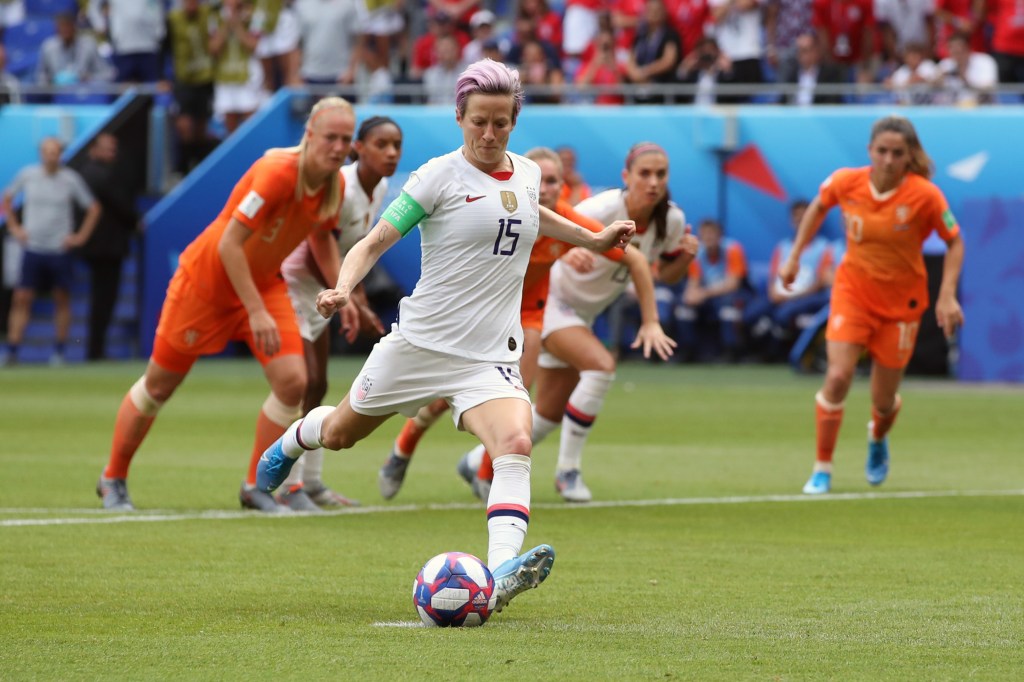 Megan Rapinoe of USA scores a goal from the penalty spot during the 2019 FIFA Women's World Cup France Final match between The United States of America and The Netherlands at Stade de Lyon on July 7, 2019 in Lyon, France. (Photo by Marc Atkins/Getty Images)