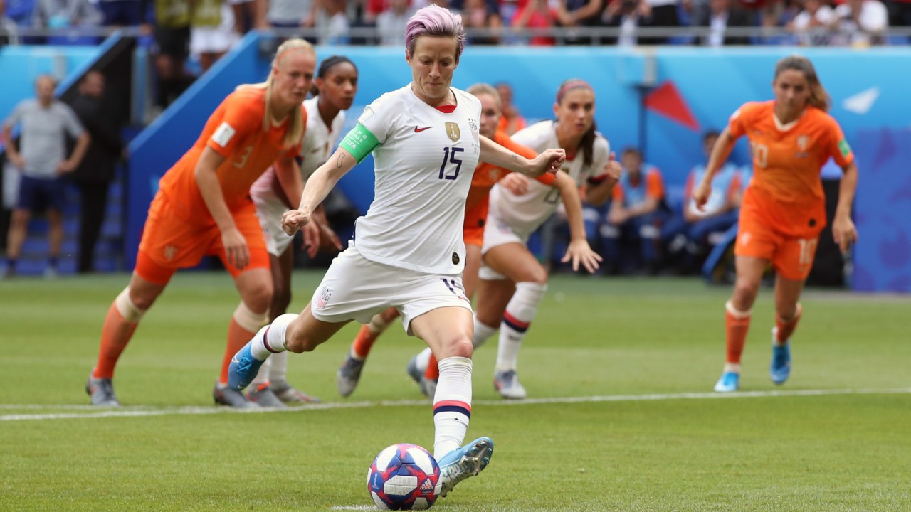 Megan Rapinoe of USA scores a goal from the penalty spot during the 2019 FIFA Women's World Cup France Final match between The United States of America and The Netherlands at Stade de Lyon on July 7, 2019 in Lyon, France. (Photo by Marc Atkins/Getty Images)