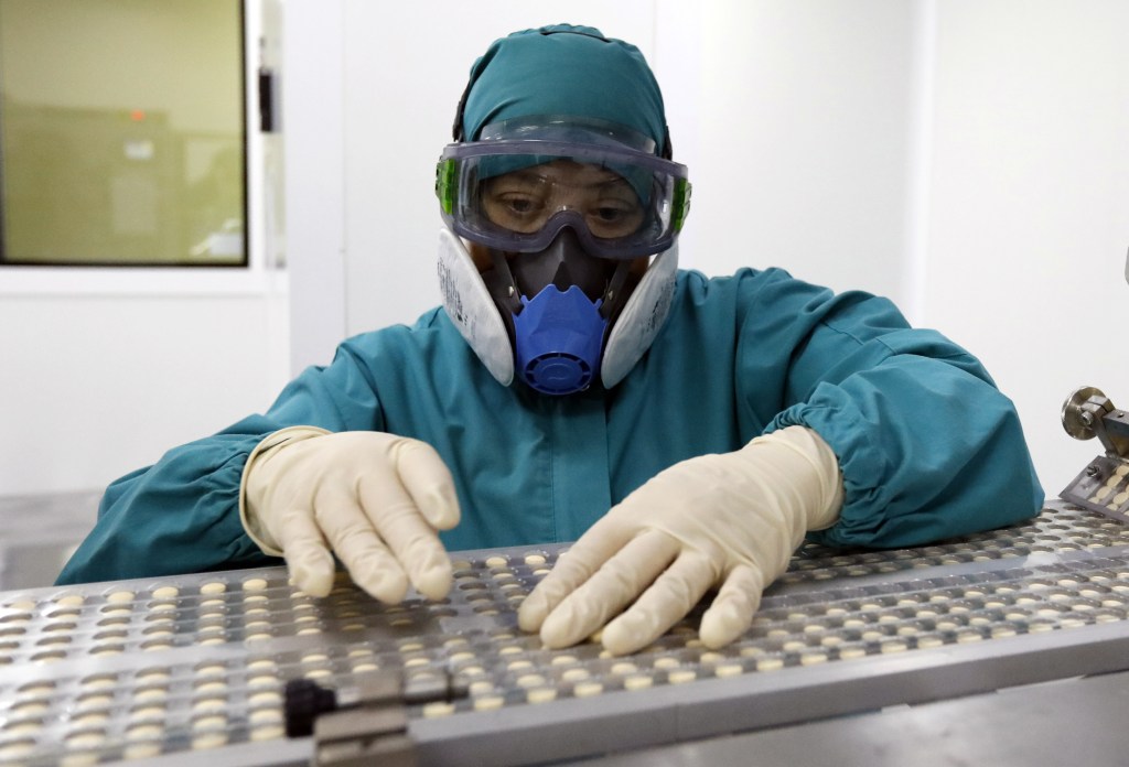 SARANSK, REPUBLIC OF MORDOVIA, RUSSIA - OCTOBER 30, 2020: A worker packs the Azithromycin pills produced at the Biokhimik [Biochemist] pharmaceutical company. Azithromycin was registered by the Russian Healthcare Ministry on 23 June 2020 and included in the guidelines for the treatment of COVID-19 patients. Artyom Geodakyan/TASS (Photo by Artyom GeodakyanTASS via Getty Images)