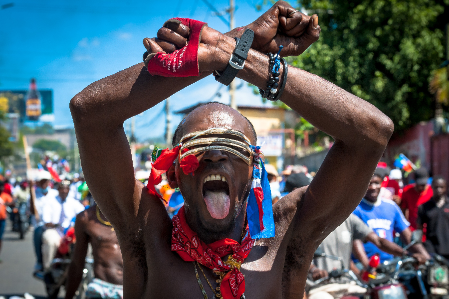 Haitians demonstrate during a protest to denounce the draft constitutional referendum carried by the President Jovenel Moise on March 28, 2021 in Port-au-Prince, Haiti