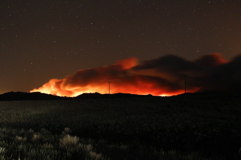 BECKWOURTH, UNITED STATES - 2021/07/09: Flames illuminate the smoke rising from the Beckwourth complex fire.The Beckwourth Complex fire continues to burn through the night. (Photo by Ty ONeil/SOPA Images/LightRocket via Getty Images)