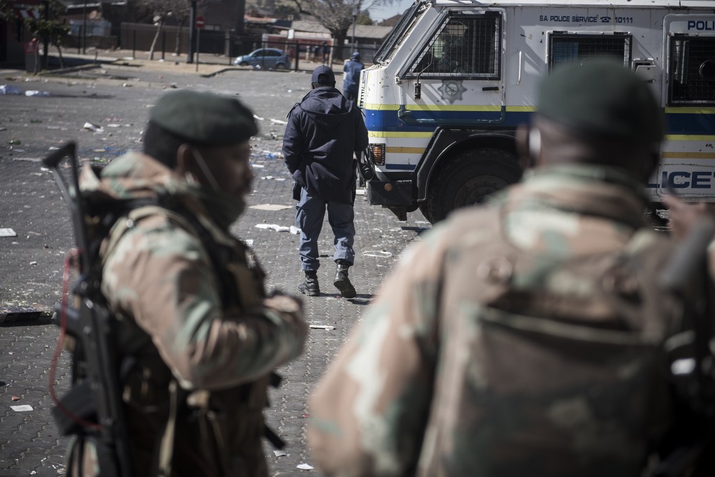 JOHANNESBURG, SOUTH AFRICA - JULY 13: South African National Defense Force (SANDF) members patrol at streets and looted places as death toll in South Africa's violent protests against the imprisonment of former President Jacob Zuma has risen to 45, in Soweto region in Johannesburg, South Africa on July 13, 2021. (Photo by Shiraaz Mohamed/Anadolu Agency via Getty Images)