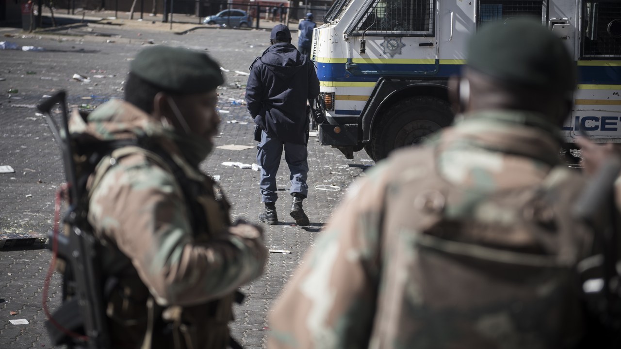 JOHANNESBURG, SOUTH AFRICA - JULY 13: South African National Defense Force (SANDF) members patrol at streets and looted places as death toll in South Africa's violent protests against the imprisonment of former President Jacob Zuma has risen to 45, in Soweto region in Johannesburg, South Africa on July 13, 2021. (Photo by Shiraaz Mohamed/Anadolu Agency via Getty Images)