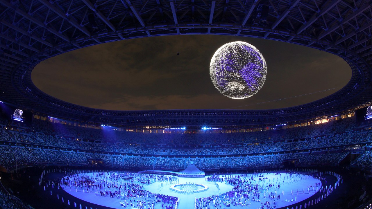 TOKYO, JAPAN - JULY 23: A drone display is seen over the top of the stadium during the Opening Ceremony of the Tokyo 2020 Olympic Games at Olympic Stadium on July 23, 2021 in Tokyo, Japan. (Photo by Laurence Griffiths/Getty Images)