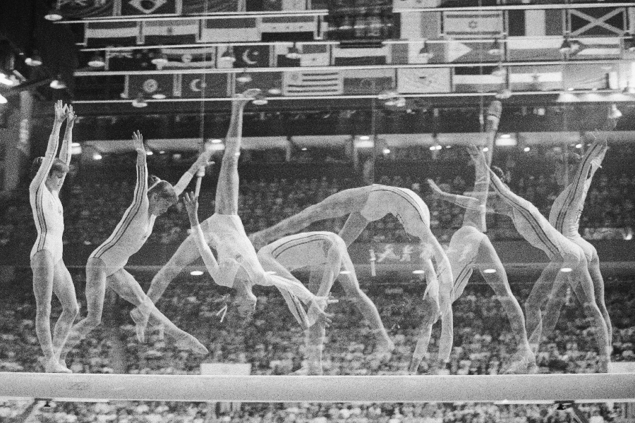Multiple exposure show's Romania's Nadia Comaneci on the balance beam in Olympic women gymnastics 7/22, as she went on to win her second gold medal of the night, and her third of the games.