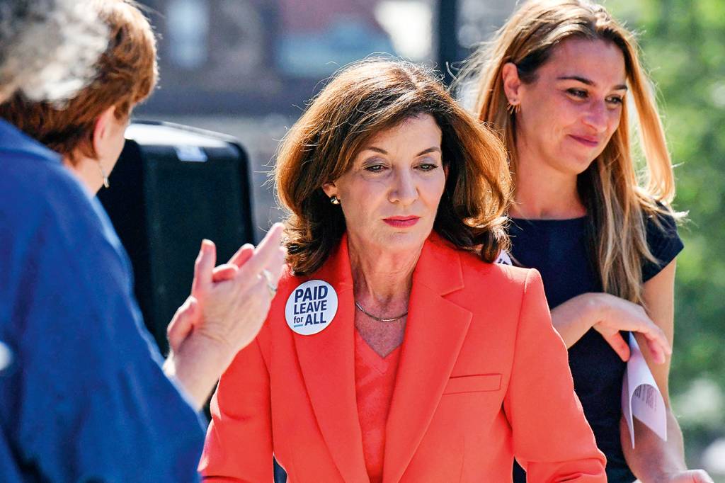 Lt. Gov. Kathy Hochul, center, joins advocates for paid family and medical leave for all working people during a stop on the Paid Leave for All's national bus tour on Tuesday, Aug. 3, 2021, in Albany N.Y. New York Gov. Andrew Cuomo faced mounting pressure Tuesday to resign, including from President Joe Biden and other onetime Democratic allies, after an investigation found he sexually harassed nearly a dozen women and worked to retaliate against one of his accusers. Hochul, who would succeed Cuomo if he is removed or resigns, called the behavior detailed in the report 