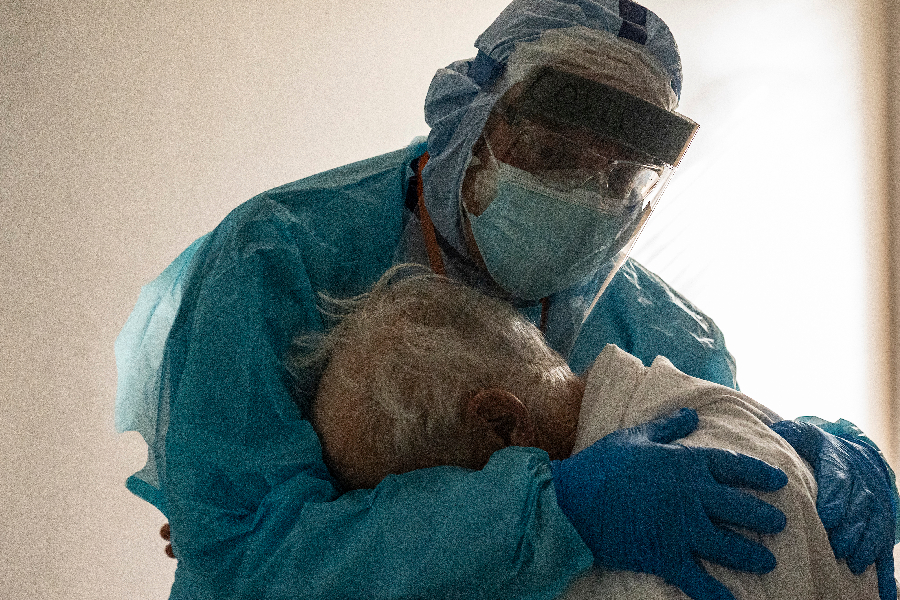 Dr. Joseph Varon hugs and comforts a patient in the COVID-19 intensive care unit (ICU) during Thanksgiving at the United Memorial Medical Center on November 26, 2020 in Houston, Texas