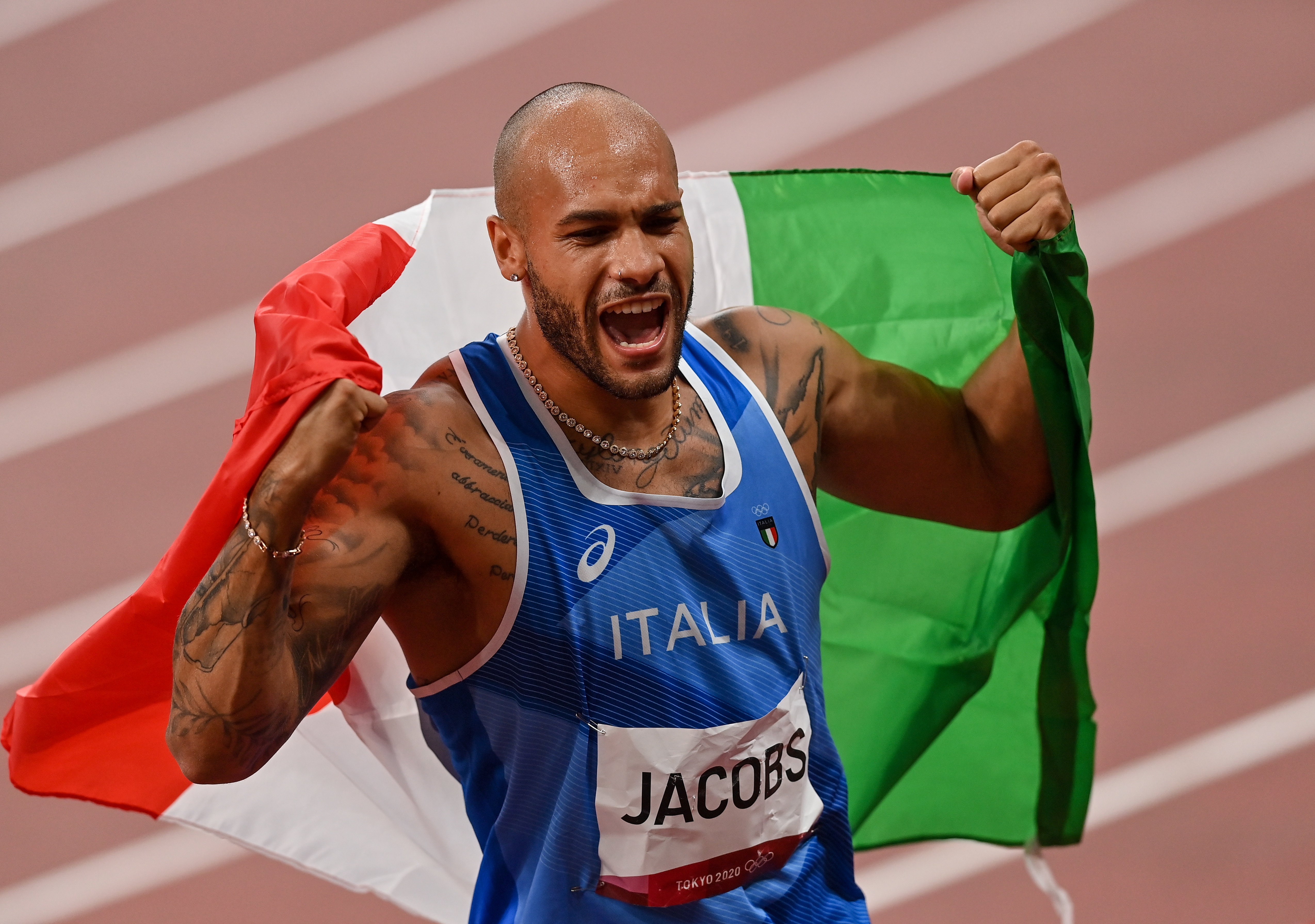 Tokyo , Japan - 1 August 2021; Lamont Marcell Jacobs of Italy celebrates winning the men's 100 metres final at the Olympic Stadium on day nine of the 2020 Tokyo Summer Olympic Games in Tokyo, Japan. (Photo By Ramsey Cardy/Sportsfile via Getty Images)
