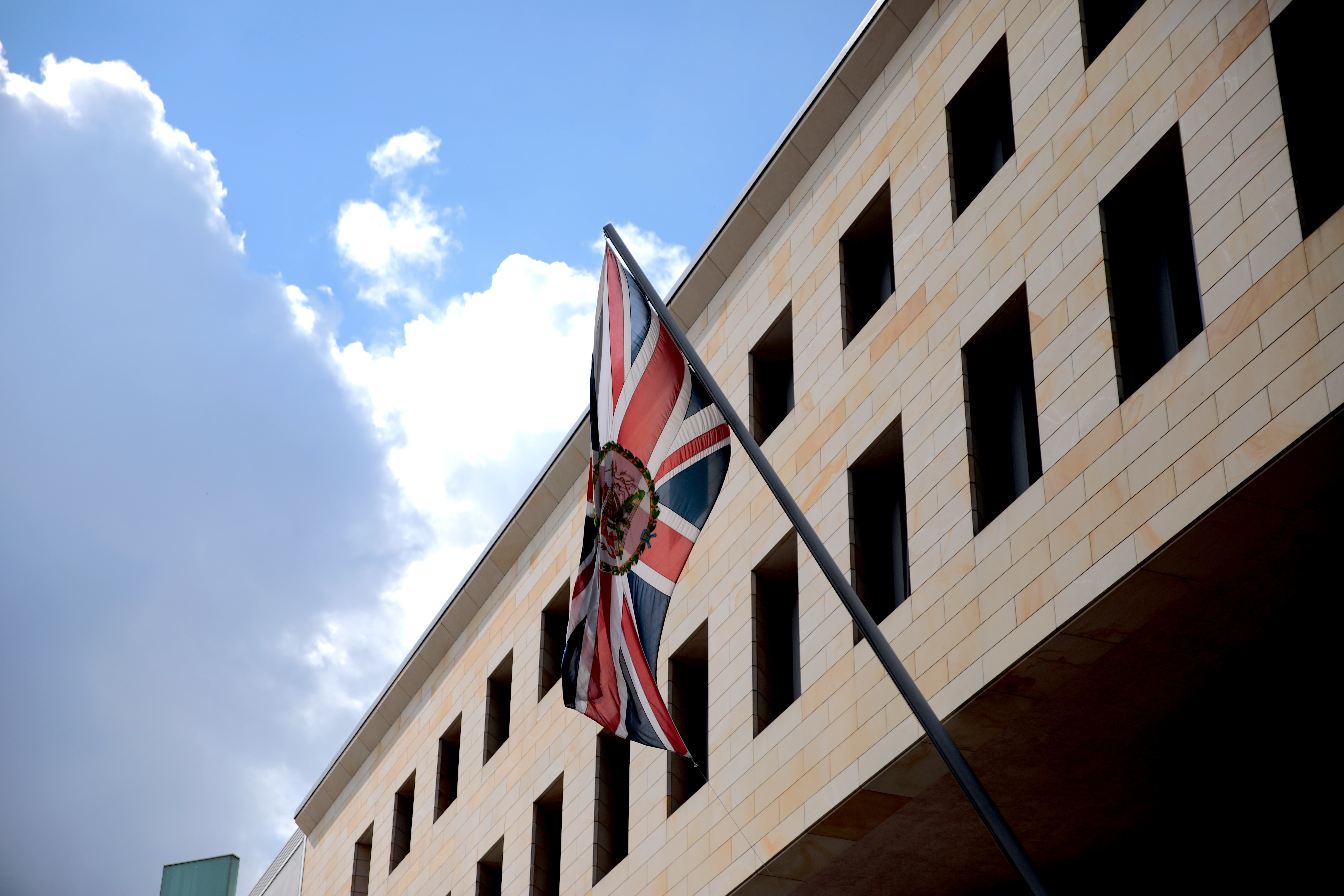 BERLIN, GERMANY - AUGUST 11: The british national flag waves outside the British Embassy on August 11, 2021 in Berlin, Germany. German law enforcement authorities announced today that they have arrested a British national who worked at the embassy, David S., on charges of espionage. According to the federal prosecutor's office David S. handed over embassy documents to a member of the Russian intelligence service in exchange for an undisclosed amount of cash. (Photo by Carsten Koall/Getty Images)