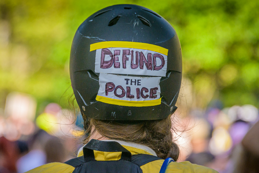 A member of Street Riders NYC carrying a Defund The Police sign on her helmet - 25/07/2020 -