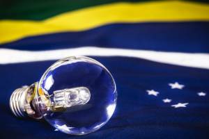 extinguished light bulb over the Brazilian flag, concept of Brazilian energy crisis, blackout risk