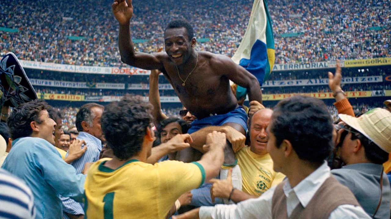 ** ADVANCE FOR WEEKEND EDITONS, MAY 29-30 ** FILE - In this June 21, 1970 file photo, Brazil's Pele is hoisted on shoulders of his teammates after Brazil won the World Cup final against Italy, 4-1, in Mexico City's Estadio Azteca. (AP Photo/File)