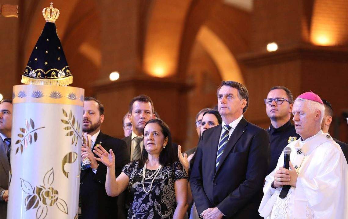 O presidente Jair Bolsonaro, durante missa em Aparecida, no Dia da Padroeira