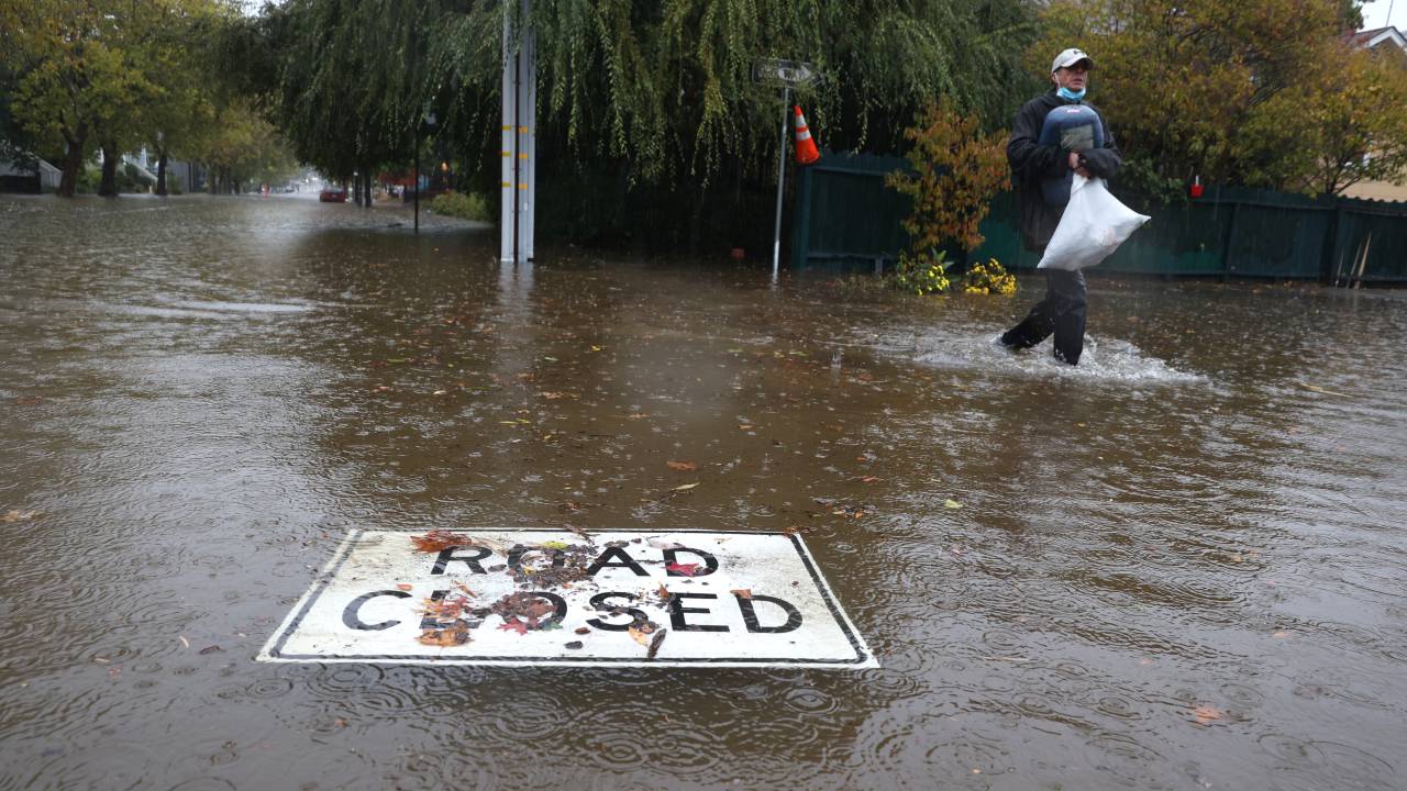 SAN RAFAEL, CALIFORNIA - OCTOBER 24: A road closed sign floats on a flooded street on October 24, 2021 in San Rafael, California. A Category 5 atmospheric river is bringing heavy precipitation, high winds and power outages to the San Francisco Bay Area. The storm is expected to bring anywhere between 2 to 5 inches of rain to many parts of the area. (Photo by Justin Sullivan/Getty Images)