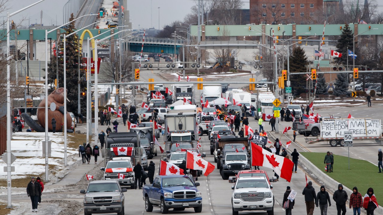 WINDSOR, ON - February 10: Protestors and supporters set up at a blockade at the foot of the Ambassador Bridge, sealing off the flow of commercial traffic over the bridge into Canada from Detroit, on February 10, 2022 in Windsor, Canada. As a convoy of truckers and supporters continues to occupy Ottawas downtown, blockades and convoys have popped up around the country in support of the protest against Canada's COVID-19 vaccine mandate for cross-border truckers. (Photo by Cole Burston/Getty Images)