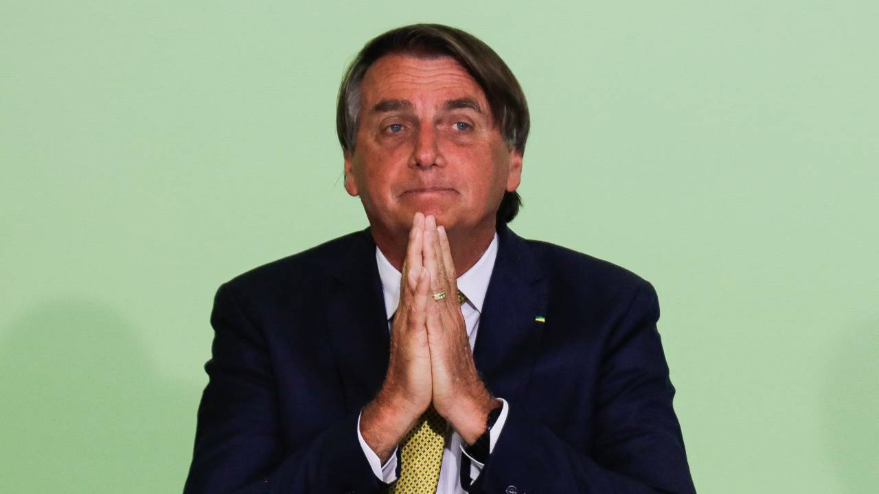 Brazilian President Jair Bolsonaro gestures during the commemoration of the Rare Disease Day at the Planalto Palace in Brasilia, on March 3, 2022. (Photo by Sergio Lima / AFP)