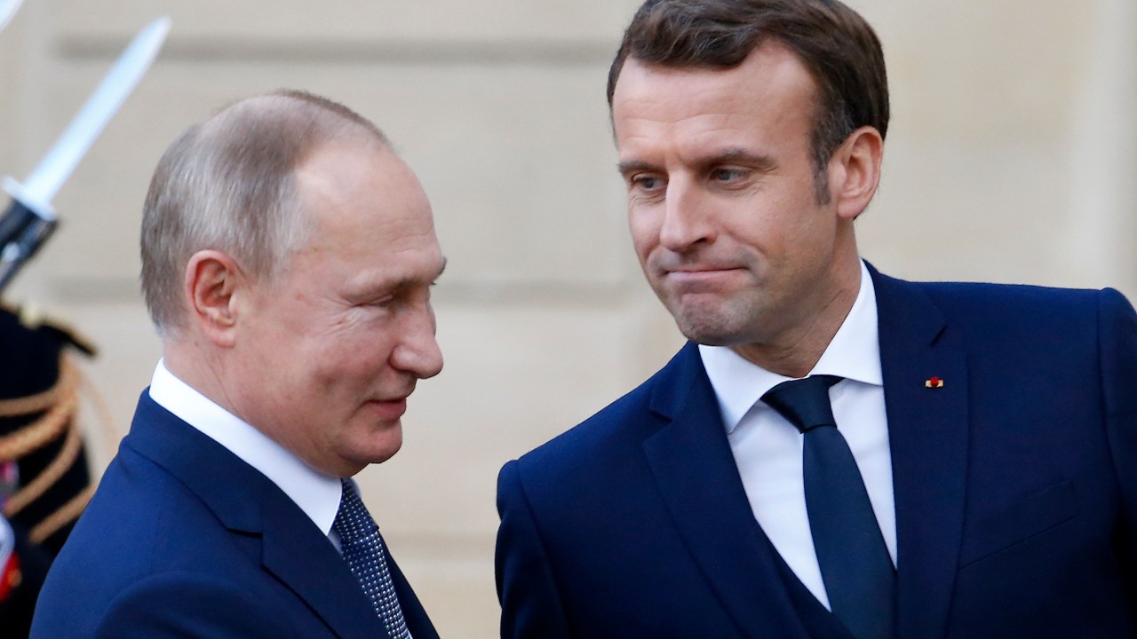 PARIS, FRANCE - DECEMBER 09: French President Emmanuel Macron welcomes Russian President, Vladimir Putin as he arrives at the Elysee Presidential Palace to attend a summit on Ukraine on December 09, 2019 in Paris, France.