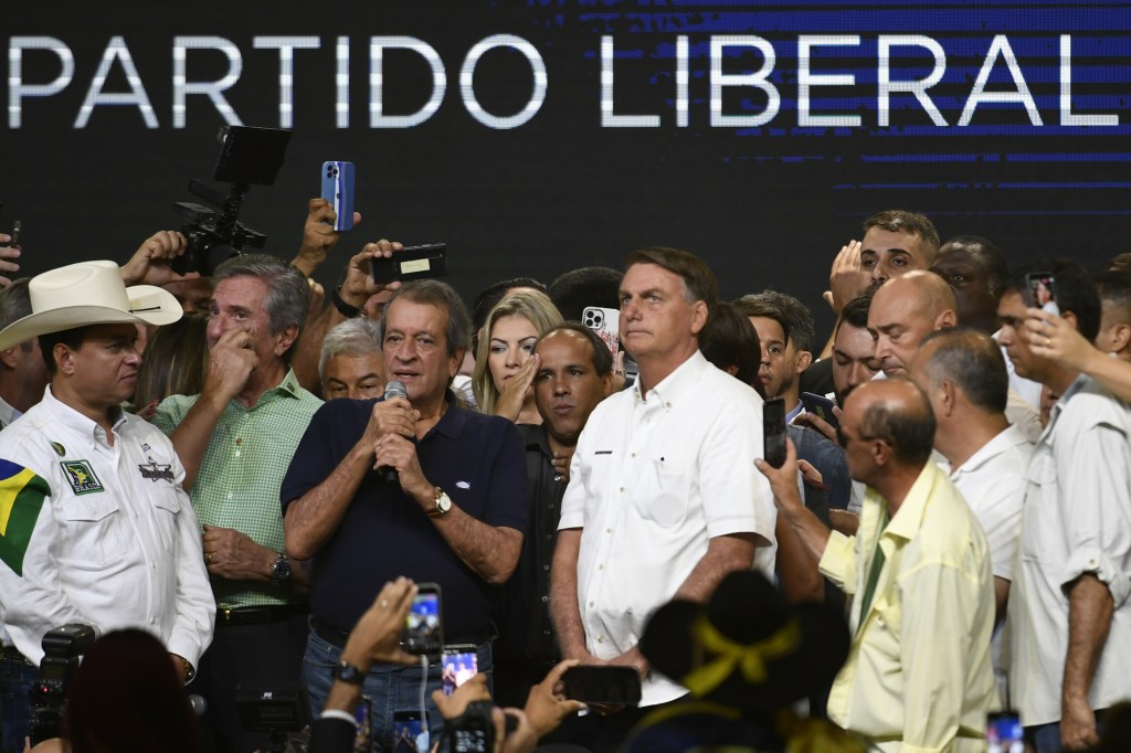 BRASILIA, BRAZIL - MARCH 27: Brazil's President, Jair Bolsonaro (C), attend an event with members of his "Liberal Party" or PL and with supporters during the "Vou com ele" campaign, in Brasilia, Brazil, March 27, 2022. Bolsonaro, who is running for reelection, participates in the party event to present his candidacy for the next presidential elections scheduled for October 2022. (Photo by Mateus Bonomi/Anadolu Agency via Getty Images)