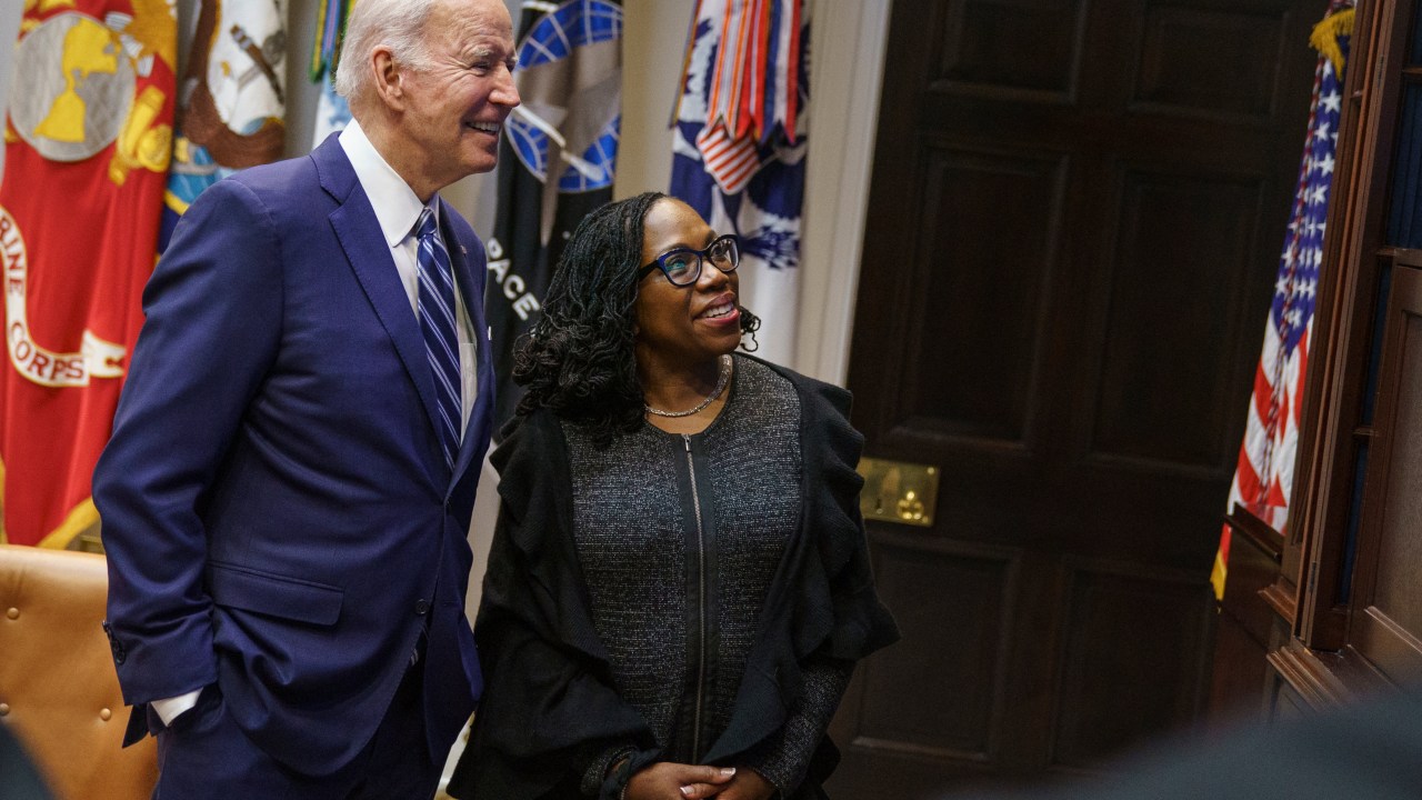 US President Joe Biden embraces Judge Ketanji Brown Jackson as they watch the Senate vote on her nomination to be an associate justice on the US Supreme Court, from the Roosevelt Room of the White House in Washington, DC on April 7, 2022. (Photo by MANDEL NGAN / AFP)