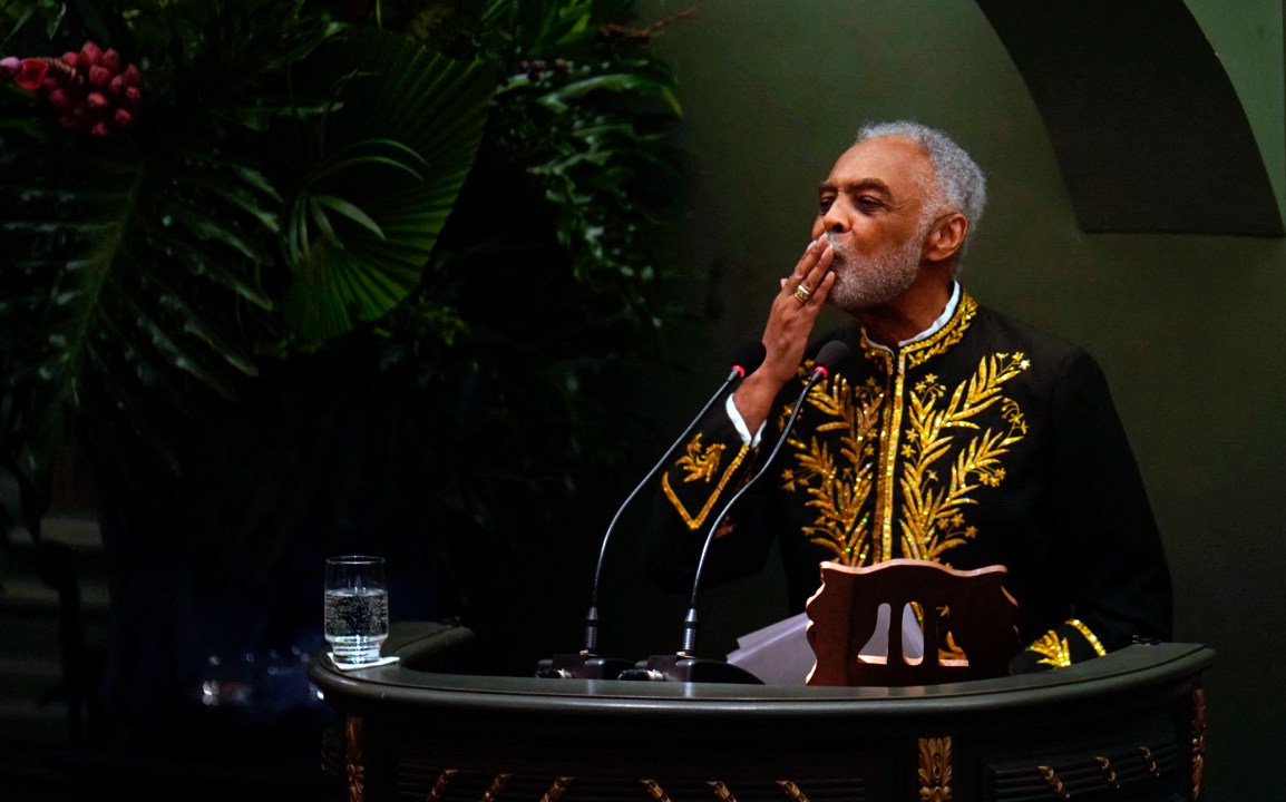 Brazilian songwriter and former Culture Minister Gilberto Gil gestures during his swearing-in ceremony as an "immortal" member of the Academia Brasileira de Letras (ABL-Brazilian Letters Academy) in Rio de Janeiro, Brazil, on April 8, 2022. (Photo by Mauro Pimentel / AFP)