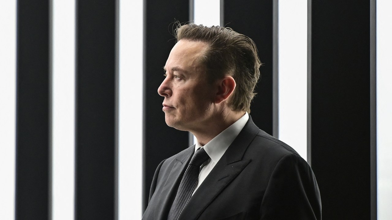 (FILES) In this file photo taken on March 22, 2022, Tesla CEO Elon Musk is pictured as he attends the start of the production at Tesla's "Gigafactory" in Gruenheide, southeast of Berlin. - Tesla chief Elon Musk has launched a hostile takeover bid for Twitter, insisting it was a "best and final offer" and that he was the only person capable of unlocking the full potential of the platform. (Photo by Patrick Pleul / POOL / AFP)
