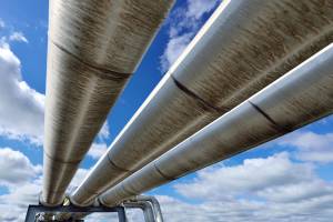 Three Pipeline Reflecting Blue Sky