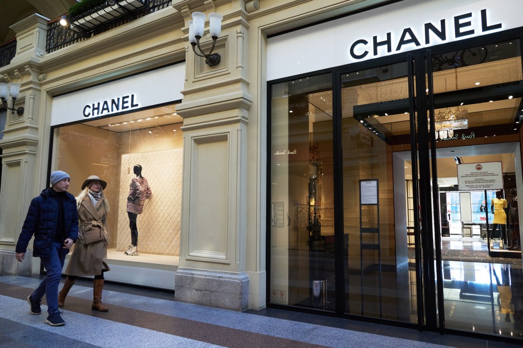 MOSCOW, RUSSIA - MARCH 26: Shoppers go past closed Chanel store in GUM department store on March 26, 2022 in Moscow, Russia. More than 400 companies have already announced their withdrawal from the Russian market or the suspension of activities in Russia. (Photo by Oleg Nikishin/Getty Images)