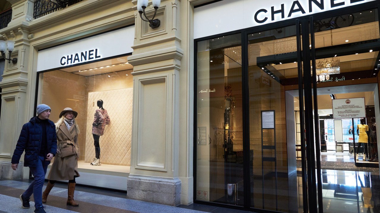 MOSCOW, RUSSIA - MARCH 26: Shoppers go past closed Chanel store in GUM department store on March 26, 2022 in Moscow, Russia. More than 400 companies have already announced their withdrawal from the Russian market or the suspension of activities in Russia. (Photo by Oleg Nikishin/Getty Images)