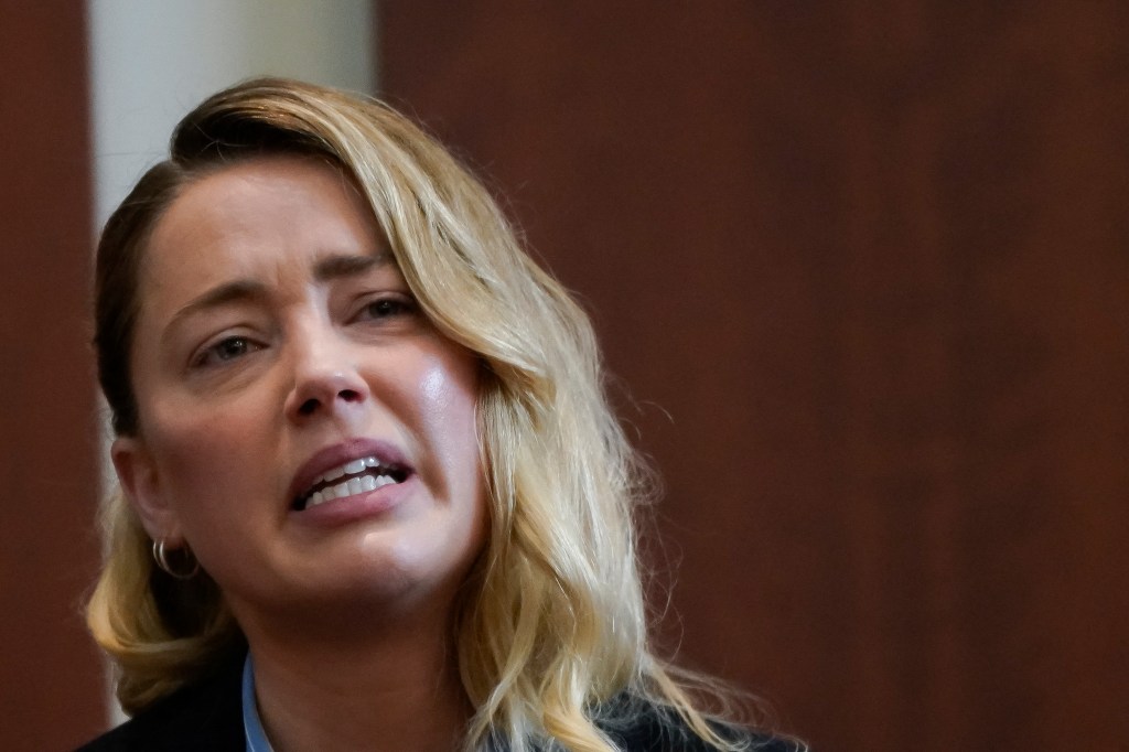 Actor Amber Heard testifies about the first time her ex-husband, actor Johnny Depp hit her, at Fairfax County Circuit Court during a defamation case against her by Depp in Fairfax, Virginia, on May 4, 2022. - US actor Johnny Depp sued his ex-wife Amber Heard for libel in Fairfax County Circuit Court after she wrote an op-ed piece in The Washington Post in 2018 referring to herself as a "public figure representing domestic abuse." (Photo by ELIZABETH FRANTZ / POOL / AFP)