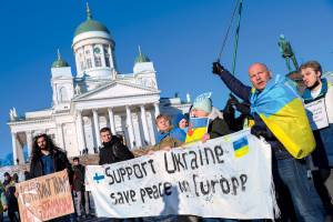Protesters hold a banner during a Ukraine-Russia Anti-war