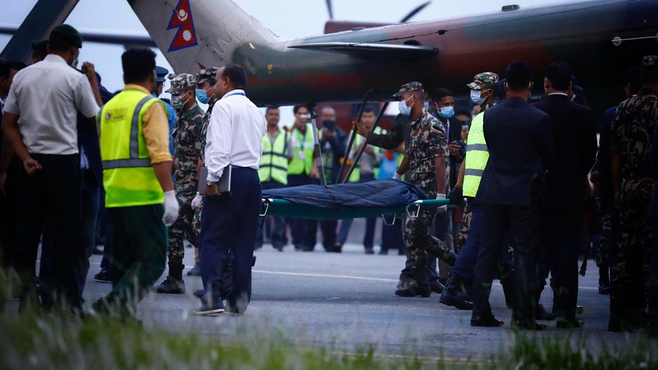 Nepalese soliders carry the body of a victim killed in a Tara Air plane crash as it arrives in Kathmandu , Nepal, Monday, May 30, 2022. The government has formed a five-member commission to probe the Tara Air plane crash at Sanosware in Mustang district of Nepal that claimed the lives of 22 people including three crew members. (Photo by Saroj Baizu/NurPhoto via Getty Images)